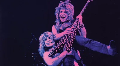 Randy Rhoads via Eddie Van Halen como referência e queria superar a imitação